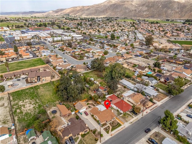 250 N Wateka St, San Jacinto, CA 92583 - aerial view of property and surrounding area featuring a mountain backdrop and nearby suburban area