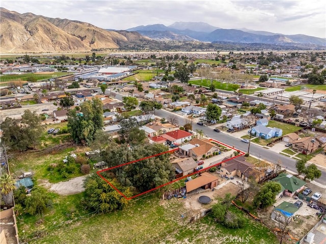 250 N Wateka St, San Jacinto, CA 92583 - aerial view of residential area featuring property parcel outlined and a mountainous background