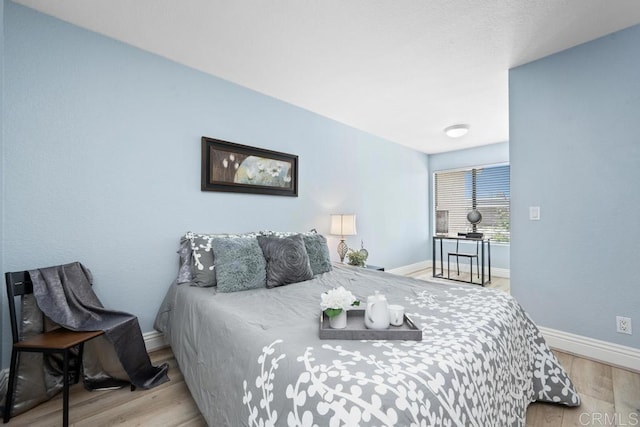8731 Graves Ave Unit 13, Santee, CA 92071 - bedroom featuring baseboards and wood finished floors