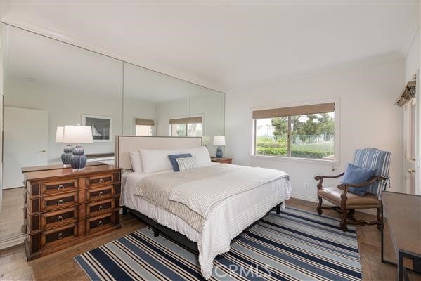bedroom with wood finished floors