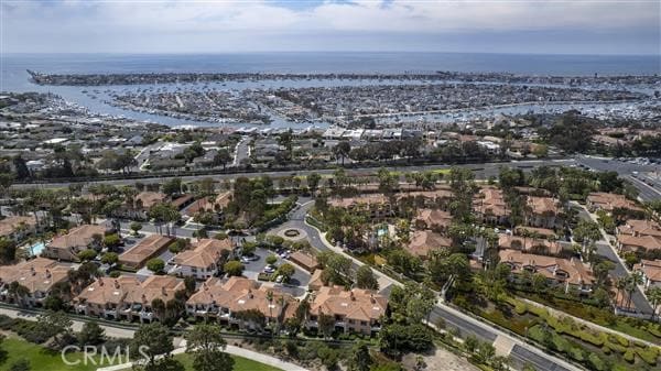 birds eye view of property with a residential view and a water view