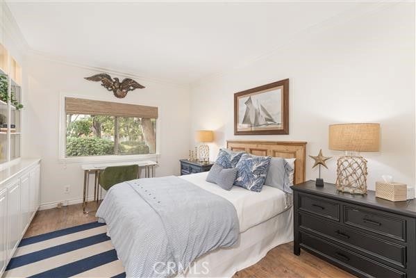 bedroom featuring light wood-style flooring