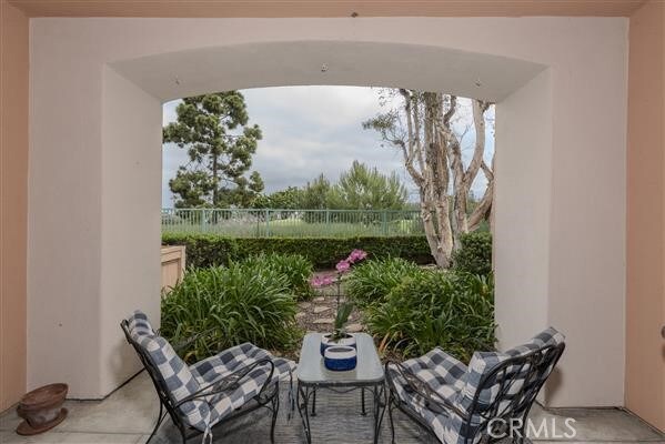 view of patio with outdoor dining area and fence