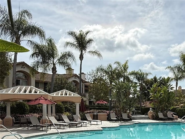 community pool featuring a patio area