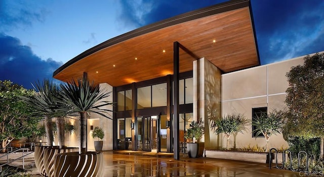 property entrance with stucco siding