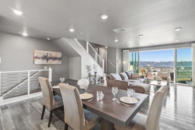 dining space with wood finished floors, visible vents, and recessed lighting