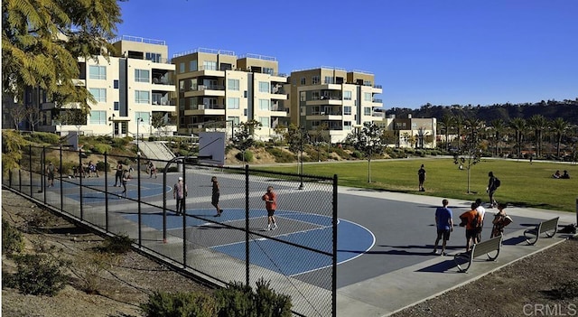 view of sport court featuring fence