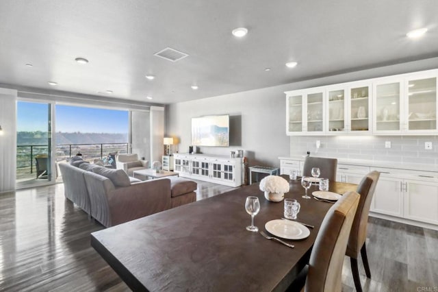 dining room featuring recessed lighting, dark wood finished floors, and visible vents