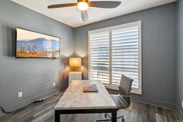 office featuring baseboards, a ceiling fan, and wood finished floors