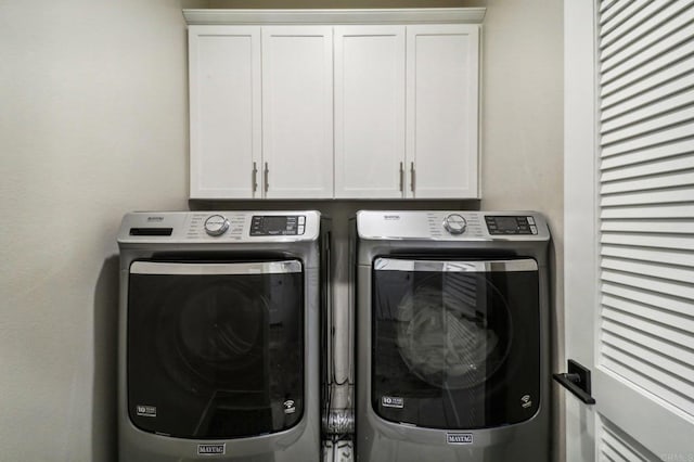laundry room with cabinet space and independent washer and dryer