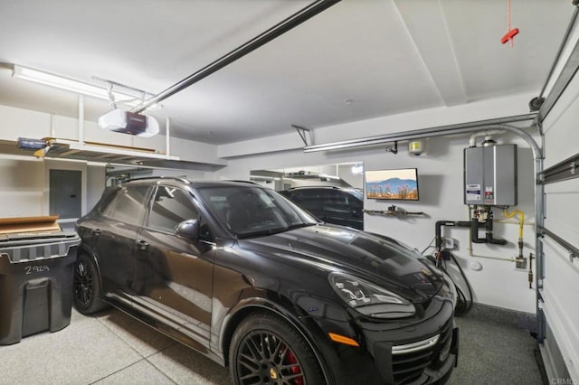 garage featuring tankless water heater, electric panel, and a garage door opener