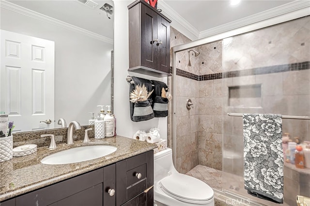 full bath featuring a shower stall, vanity, ornamental molding, visible vents, and toilet