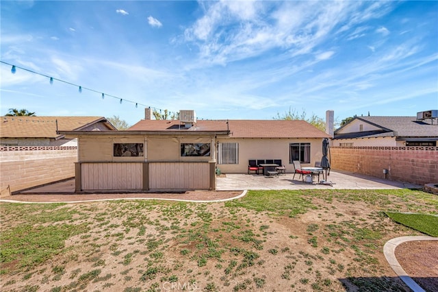 back of house featuring a patio area, a fenced backyard, and stucco siding