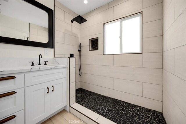 8620 S 4th Ave, Inglewood, CA 90305 - bathroom featuring a tile shower, vanity, tile patterned flooring, and recessed lighting
