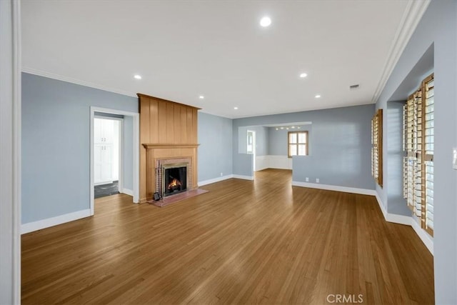 8620 S 4th Ave, Inglewood, CA 90305 - unfurnished living room with baseboards, dark wood-type flooring, ornamental molding, a fireplace, and recessed lighting