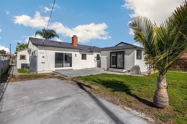 8620 S 4th Ave, Inglewood, CA 90305 - back of house with a patio area, stucco siding, and a chimney