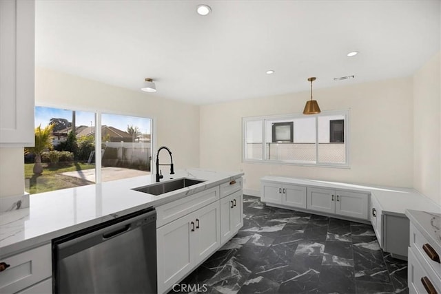 8620 S 4th Ave, Inglewood, CA 90305 - kitchen featuring stainless steel dishwasher, a sink, dark marble finish flooring, recessed lighting, and hanging light fixtures