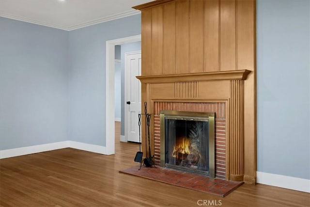 8620 S 4th Ave, Inglewood, CA 90305 - detailed view of a fireplace, baseboards, wood finished floors, and crown molding