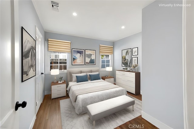 8620 S 4th Ave, Inglewood, CA 90305 - bedroom featuring wood finished floors, baseboards, and recessed lighting