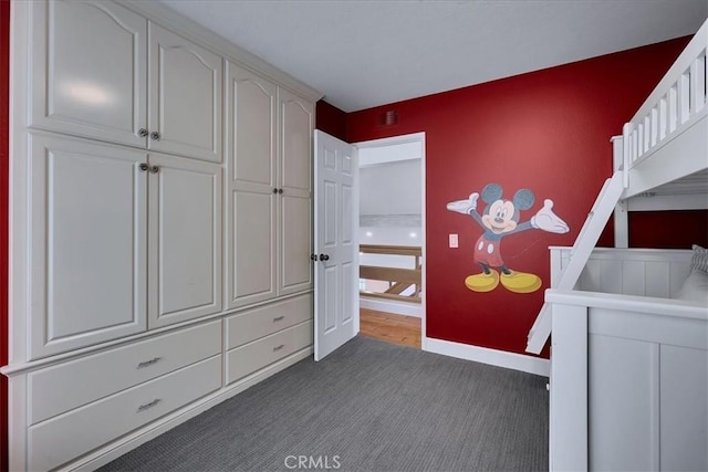 carpeted bedroom featuring baseboards