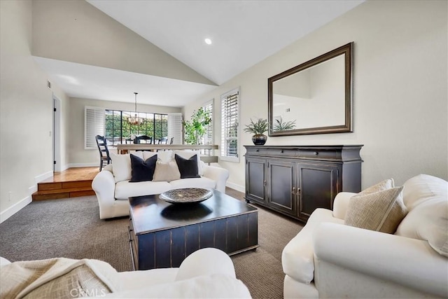 living area with carpet flooring, baseboards, and lofted ceiling
