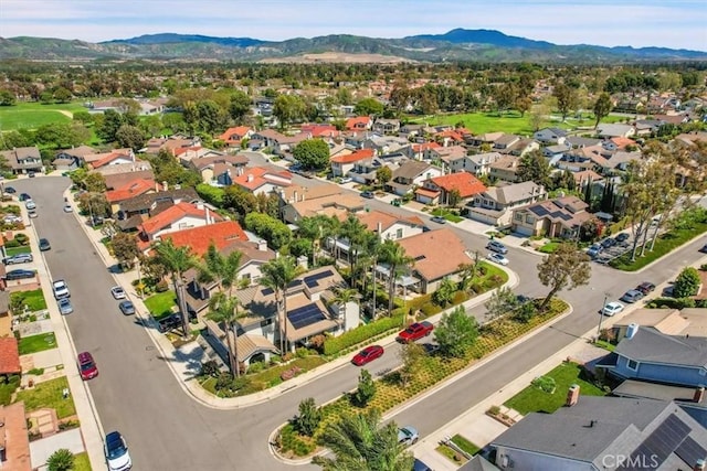 birds eye view of property with a residential view and a mountain view