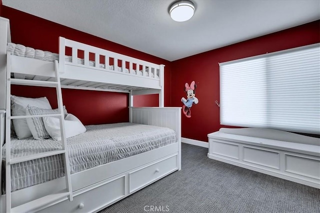 bedroom featuring carpet floors and baseboards