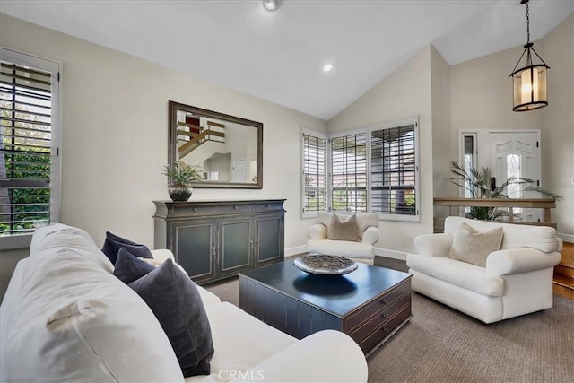 living area with high vaulted ceiling, baseboards, and recessed lighting