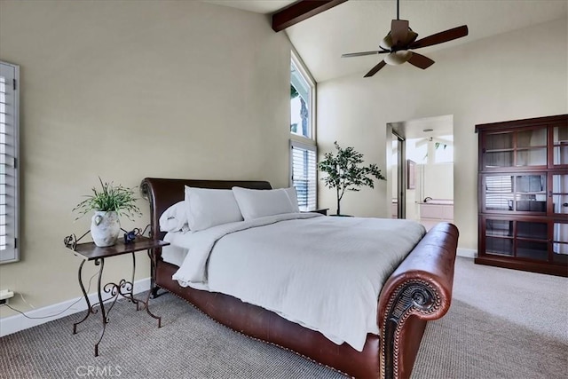 bedroom featuring baseboards, a ceiling fan, lofted ceiling with beams, and carpet floors