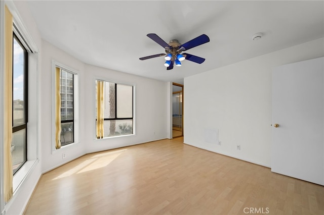 35 Linden Unit 302, Long Beach, CA 90802 - unfurnished room featuring plenty of natural light, wood finished floors, ceiling fan, and a smoke detector