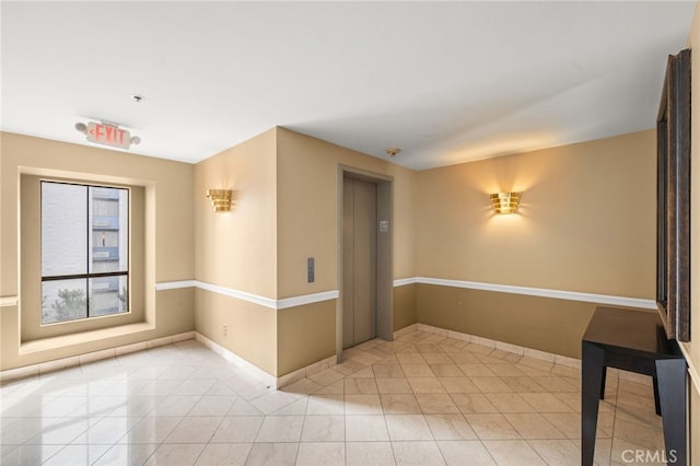 35 Linden Unit 302, Long Beach, CA 90802 - unfurnished room featuring elevator, tile patterned floors, and baseboards