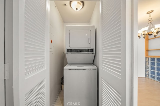 35 Linden Unit 302, Long Beach, CA 90802 - laundry area with stacked washer / dryer, a chandelier, and light wood-style flooring