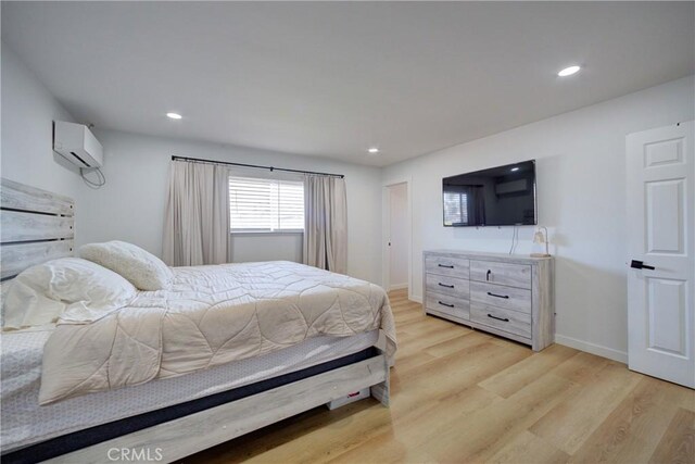 4210 Sirius Ave, Lompoc, CA 93436 - bedroom with recessed lighting, light wood-style floors, an AC wall unit, and baseboards