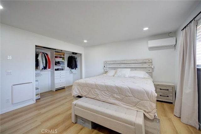 4210 Sirius Ave, Lompoc, CA 93436 - bedroom featuring light wood-type flooring, a closet, a wall mounted air conditioner, and recessed lighting