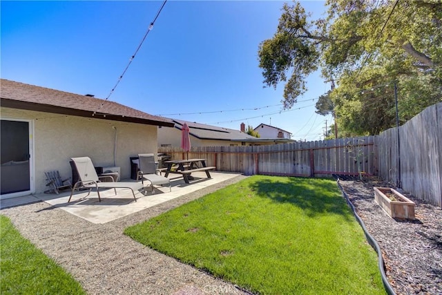 4210 Sirius Ave, Lompoc, CA 93436 - view of yard with a vegetable garden, a fenced backyard, and a patio area