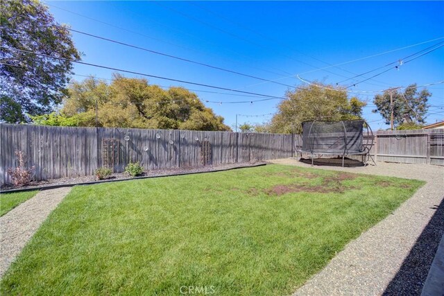 4210 Sirius Ave, Lompoc, CA 93436 - view of yard featuring a fenced backyard and a trampoline