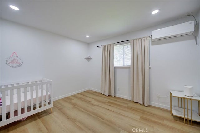 4210 Sirius Ave, Lompoc, CA 93436 - bedroom with an AC wall unit, baseboards, recessed lighting, and wood finished floors