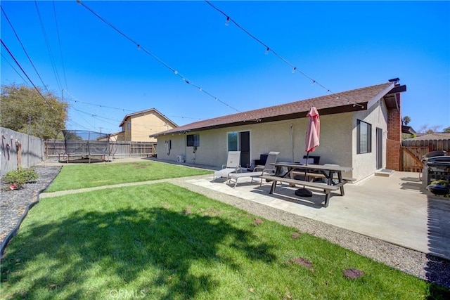 4210 Sirius Ave, Lompoc, CA 93436 - rear view of property with a yard, a fenced backyard, a patio, and stucco siding