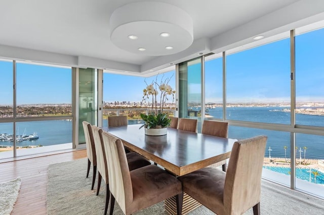sunroom / solarium with a water view
