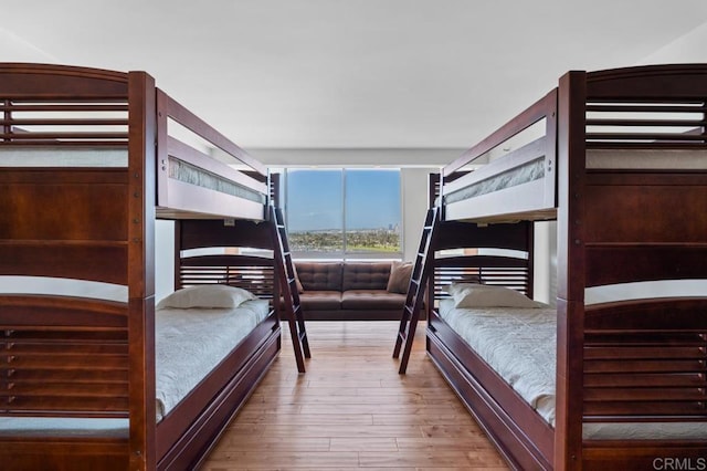 bedroom with wood-type flooring