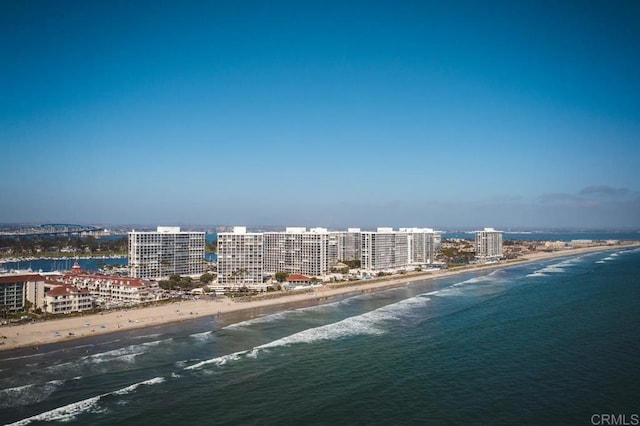 birds eye view of property with a city view, a view of the beach, and a water view