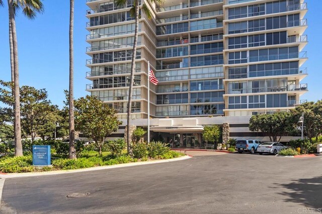 view of property featuring uncovered parking