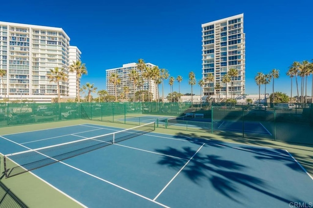 view of sport court with fence
