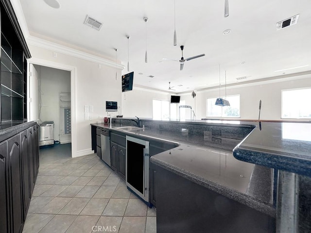 8309 Hillside Rd, Alta Loma, CA 91701 - kitchen with dark countertops, ornamental molding, light tile patterned floors, ceiling fan, and dark cabinetry