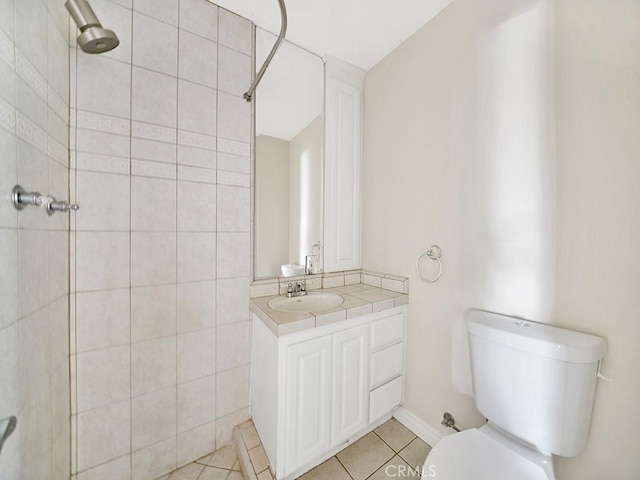 8309 Hillside Rd, Alta Loma, CA 91701 - bathroom featuring tile patterned flooring, toilet, tiled shower, and vanity