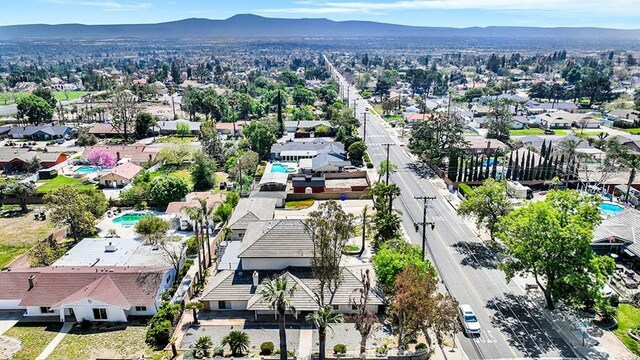 8309 Hillside Rd, Alta Loma, CA 91701 - aerial view of residential area with a mountain backdrop