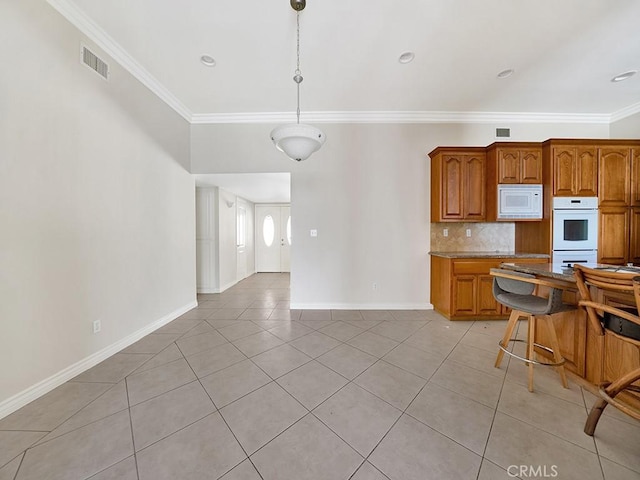 8309 Hillside Rd, Alta Loma, CA 91701 - kitchen with white appliances, light tile patterned floors, ornamental molding, tasteful backsplash, and brown cabinets