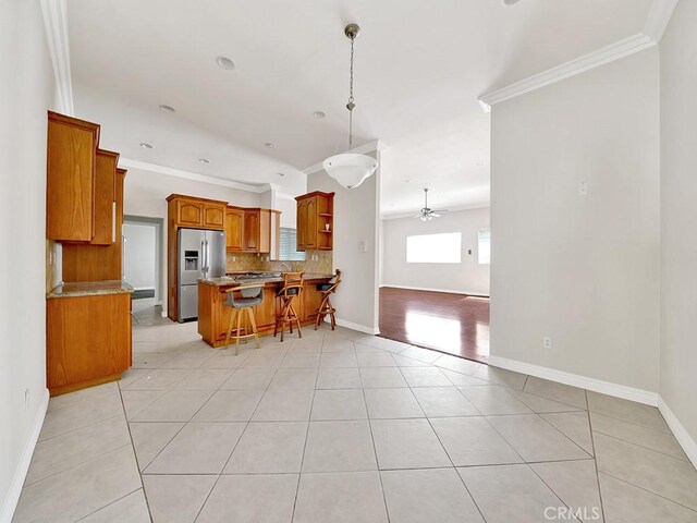 8309 Hillside Rd, Alta Loma, CA 91701 - kitchen featuring stainless steel refrigerator with ice dispenser, ceiling fan, backsplash, open floor plan, and ornamental molding