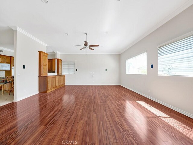 8309 Hillside Rd, Alta Loma, CA 91701 - unfurnished living room featuring ceiling fan, dark wood-type flooring, crown molding, and baseboards