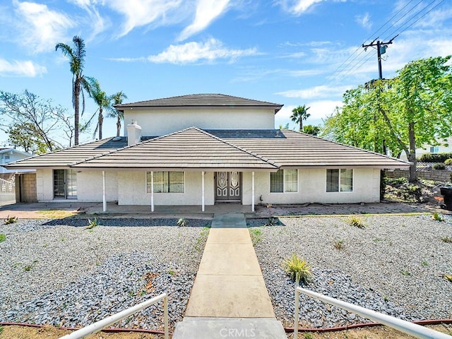 8309 Hillside Rd, Alta Loma, CA 91701 - view of front of home featuring stucco siding and a porch